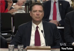 Former FBI Director James Comey prepares to testify before the Senate Intelligence Committee on Capitol Hill, June 8, 2017.