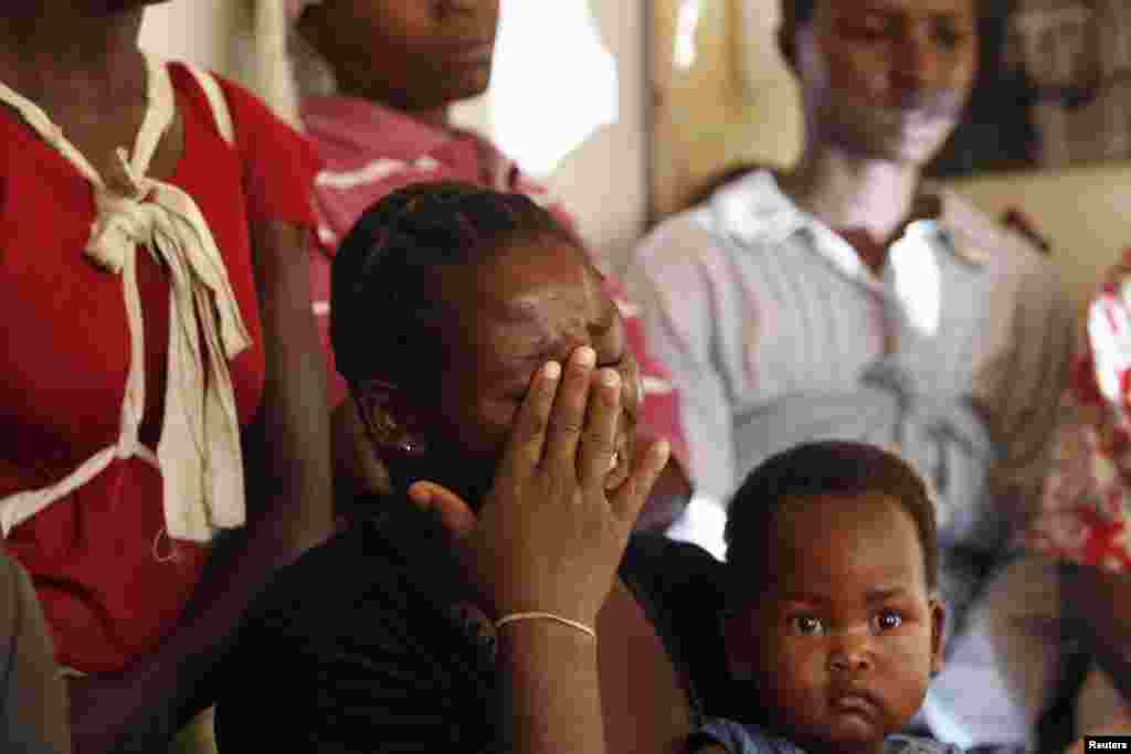 A Zimbabwe opposition Movement for Democratic Change (MDC) supporter displaced from her rural home in the north-east of the country by post election violence cries while speaking at a human rights forum in the capital Harare April 29, 2008.