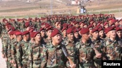 A group of Arab soldiers who have joined Kurdish peshmerga forces take part in their graduation ceremony at a training camp in Duhok province, Iraq, Feb. 7, 2017.
