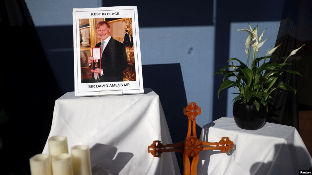 A tribute is seen in the window of Belfairs Methodist Church, where British MP David Amess was stabbed to death during a meeting with constituents, in Leigh-on-Sea, Britain, Oct. 21, 2021.