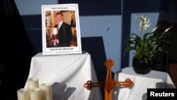 A tribute is seen in the window of Belfairs Methodist Church, where British MP David Amess was stabbed to death during a meeting with constituents, in Leigh-on-Sea, Britain, Oct. 21, 2021.