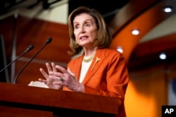 FILE - Speaker of the House Nancy Pelosi, D-Calif., speaks to reporters at the Capitol in Washington, Jan. 13, 2022.