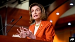 FILE - Nancy Pelosi, the speaker of the U.S. House of Representatives, talks to reporters at the Capitol in Washington, Jan. 13, 2022. 