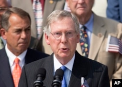 FILE - Senate Minority Leader Mitch McConnell, R-Ky., speaks as members of Congress hold a ceremony to remember the terror attacks of September 11, 2001, on the steps of the Capitol in Washington.
