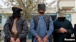 Captured Taliban insurgents presented to media in Kandahar province, Afghanistan, Jan. 7, 2014.