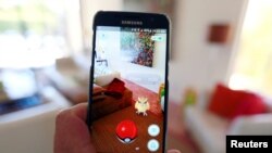 FILE - Nintendo’s augmented reality mobile game "Pokemon Go" is shown on a smartphone screen in this photo illustration taken in Palm Springs, California, July 11, 2016.