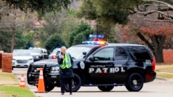 Law enforcement officials block a residential street near Congregation Beth Israel synagogue where a man took hostages during services Jan. 15, 2022, in Colleyville, Texas.