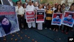 FILE - Members of a Pakistani civil society take part a demonstration against the killing of Mohammad Mashal Khan, a student at the Abdul Wali Khan University in the northwestern city of Mardan, in Karachi, Pakistan, April 22, 2017. A mob in the northwest