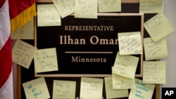 People leave Post-it notes outside the office of Rep. Ilhan Omar, D-Minn., on Capitol Hill, Feb. 11, 2019.