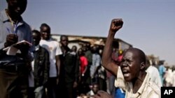 A southern Sudanese man chants pro-independence slogans outside a polling station in the southern capital of Juba Sunday, Jan. 9, 2011