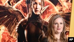 FILE - In a Monday, Nov. 17, 2014 file photo, Suzanne Collins arrives at the Los Angeles premiere of "The Hunger Games: Mockingjay - Part 1" at the Nokia Theatre L.A. Live.