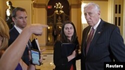 U.S. House Minority Whip Steny Hoyer, D-Md., right, talks to reporters after a failed afternoon vote on a measure to fund the Department of Homeland Security at the Capitol in Washington, Feb. 27, 2015. 