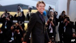 Actor Willem Dafoe poses for photographers upon arrival at the premiere of the film "At Eternity's Gate" at the 75th edition of the Venice Film Festival in Venice, Italy, Sept. 3, 2018. 