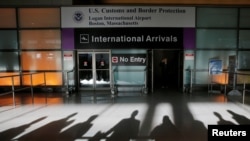 FILE - An international traveler arrives after U.S. President Donald Trump's executive order travel ban at Logan Airport in Boston, Massachusetts, Jan. 30, 2017.