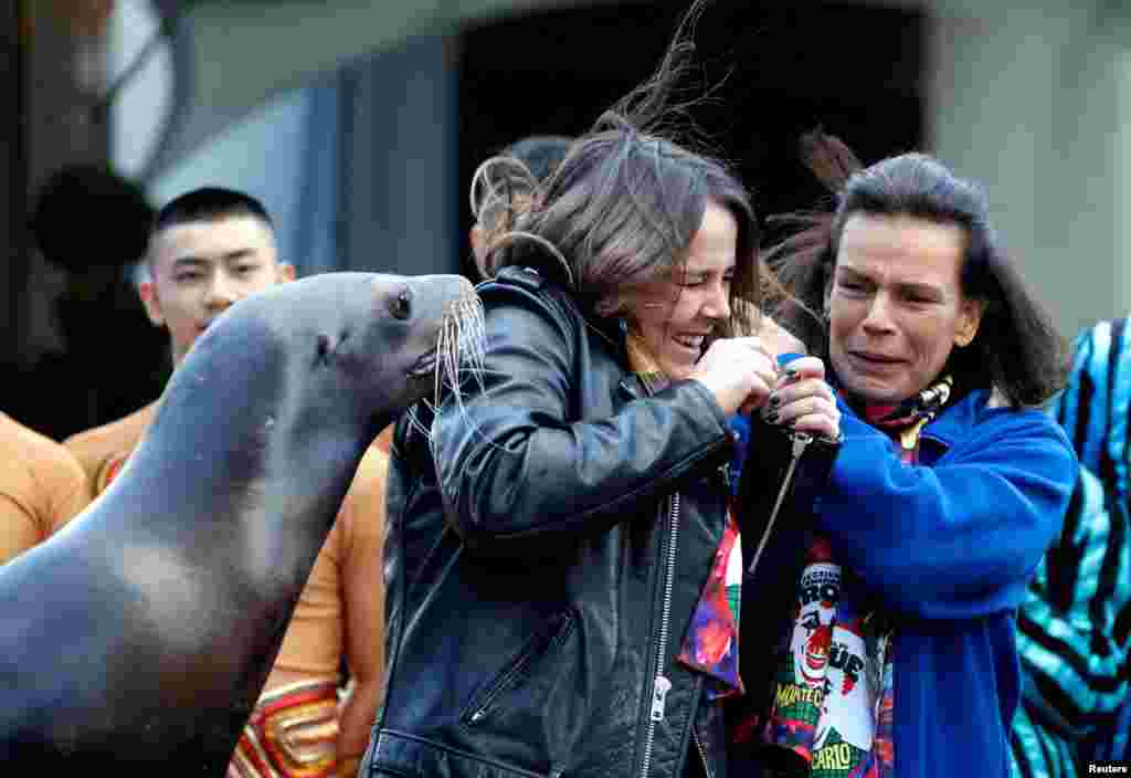 Princess Stephanie of Monaco (R) and her daughter Pauline Ducruet react as they pose with a sea lion during a photocall for the 41st Monte Carlo international circus festival in Monaco, Jan. 17, 2017.
