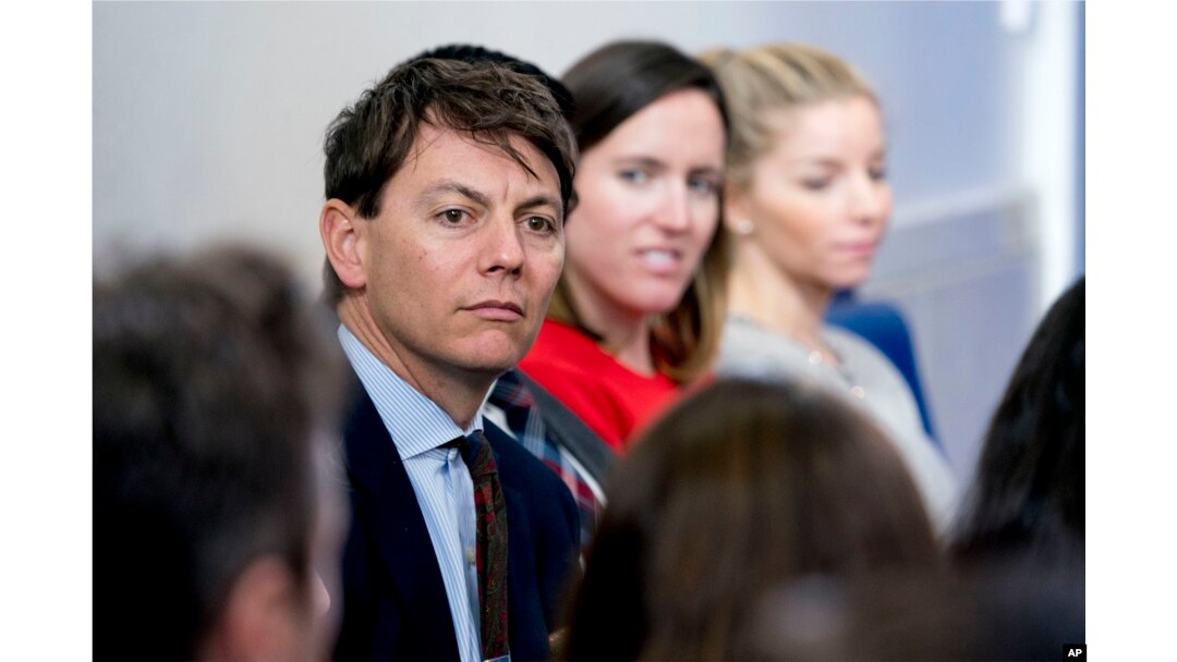 FILE - White House deputy press secretary Hogan Gidley, left, attends the daily briefing in the Brady Press Briefing Room of the White House, Oct. 20, 2017.
