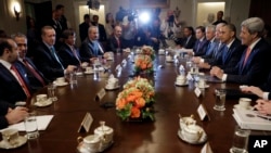 President Barack Obama, right, meets with Turkey's Prime Minister Recep Tayyip Erdogan, left, May 16, 2013, in the Cabinet Room of the White House in Washington. 