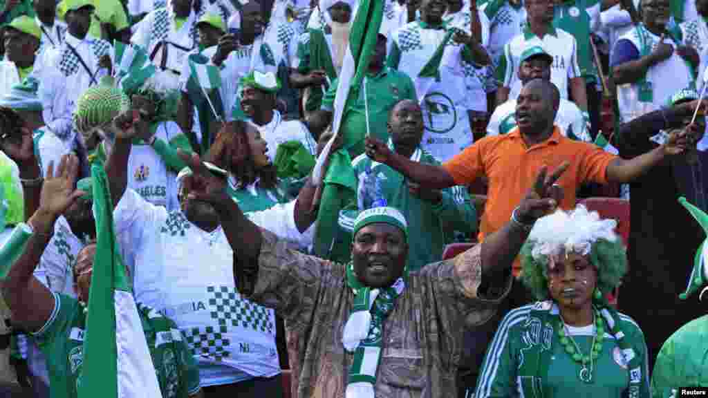 Supporters of Nigeria's football team celebrate their 2 - 1 victory over Ethiopia in their 2014 World Cup qualifying match.