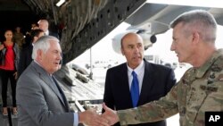Secretary of State Rex Tillerson is greeted by Gen. John Nicholson, right, commander of Resolute Support, with Special Charge d'Affaires Amb. Hugo Llorens, as he arrives, Oct. 23, 2017, at Bagram Air Base, Afghanistan.