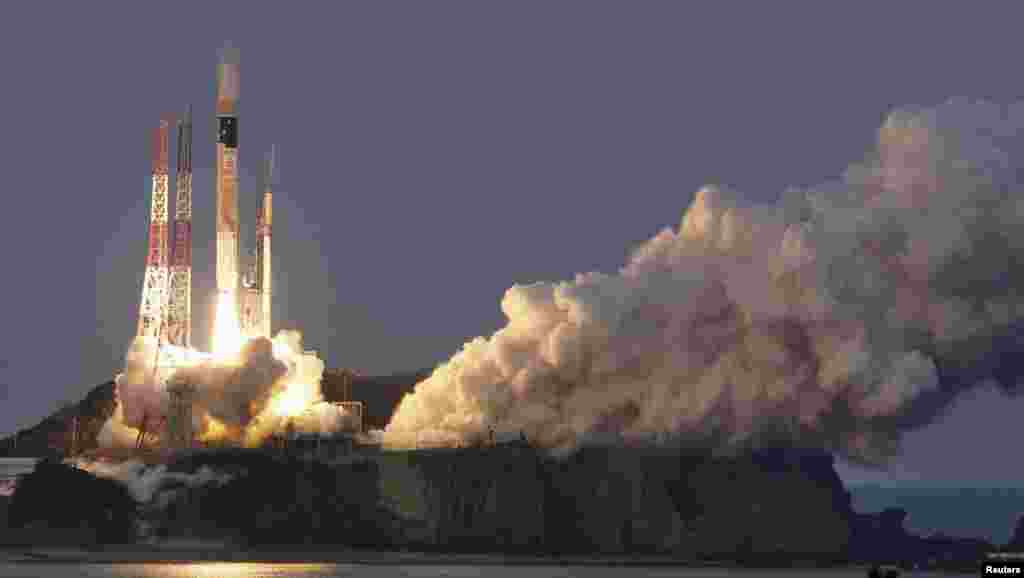 A H-IIA rocket, carrying X-ray astronomy satellite &quot;ASTRO-H&quot;, lifts off from the launch pad at Tanegashima Space Center on the Japanese southwestern island of Tanegashima, in this photo taken by Kyodo.