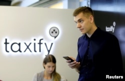 Taxify CEO Markus Villig says his company is launching in about 18 countries, mainly Eastern Europe and Africa. He is shown working at company's headquarters in Tallinn, Estonia, June 13, 2017.
