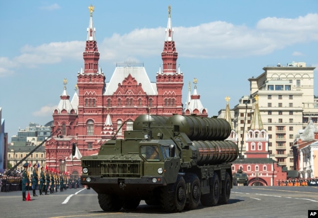 FILE - Russian S-400 air defense missile systems drive during the Victory Day military parade marking 71 years after the victory in WWII in Red Square in Moscow, Russia, May 9, 2016.
