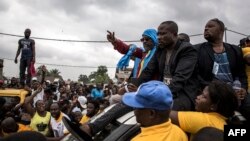 Franck Diongo (C) atomboli maboko nsima na bobimisami na boloko, Kinshasa, le 16 mars 2019.