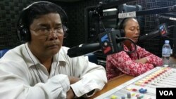 Chan Soveth, left, deputy chief of investigation at the rights group Adhoc, and Um Sophy, right, a village representative, from Kampong Chhnang province. 