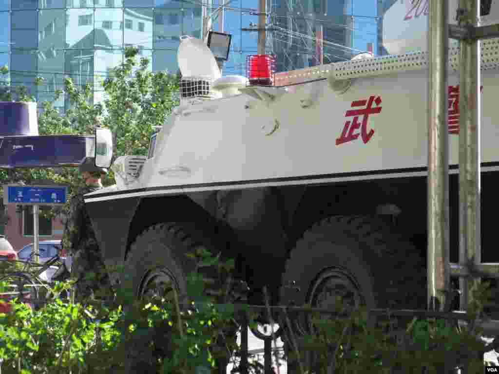 Armored vehicles patrol in Urumqi, China, May 25, 2014. (Fred Wong/VOA)