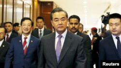 China's Foreign Minister Wang Yi arrives at a meeting during the 48th Association of Southeast Asian Nations (ASEAN) foreign ministers meeting in Kuala Lumpur, Malaysia, Aug. 4, 2015. 