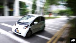 An autonomous vehicle is driven during its test drive in Singapore Wednesday, Aug. 24, 2016.