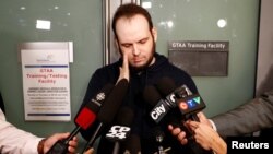 Joshua Boyle speaks to the media after arriving with his wife and three children at Toronto Pearson International Airport, nearly five years after he and his wife were abducted in Afghanistan in 2012 by the Taliban-allied Haqqani network, in Toronto, Oct.