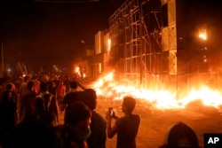 Protesters burn local parties' offices during anti-government protests in Basra, southeast of Baghdad, Iraq, Sept. 6, 2018.