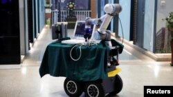 This photo shows a robot designed to help medical workers treat coronavirus patients is seen, after being placed for pictures, during a demonstration for the media at the aerospace engineering school of Tsinghua University in Beijing, China March 4, 2020.