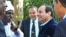 FILE - Former military chief Abdel Fattah el-Sissi (center right) speaks to members of the Nubian community in Cairo.