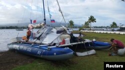 A general view of an inflatable catamaran whose crew were rescued after the vessel was damaged from several shark attacks, in this handout picture taken in Tahiti, French Polynesia, June 14, 2023. Russian Ocean Way/Handout via REUTERS 