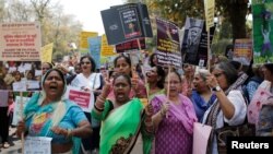 Women shout slogans as they hold during a protest march demanding to vote and reject the current environment of hate and violence in the country, in New Delhi, India, April 4, 2019.