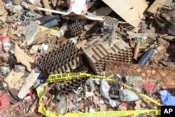 Fireworks debris is seen outside the home where a New Year's Eve fireworks explosion killed and injured people, Jan. 1, 2025, in Honolulu.