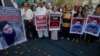 FILE - Members of a Pakistani civil society take part a demonstration against the killing of Mohammad Mashal Khan, a student at the Abdul Wali Khan University in the northwestern city of Mardan, in Karachi, Pakistan, April 22, 2017. A mob in the northwest