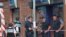 Police officers take positions in front the CIC bank where a man held hostages, in the southern French city of Toulouse, June 20, 2012.