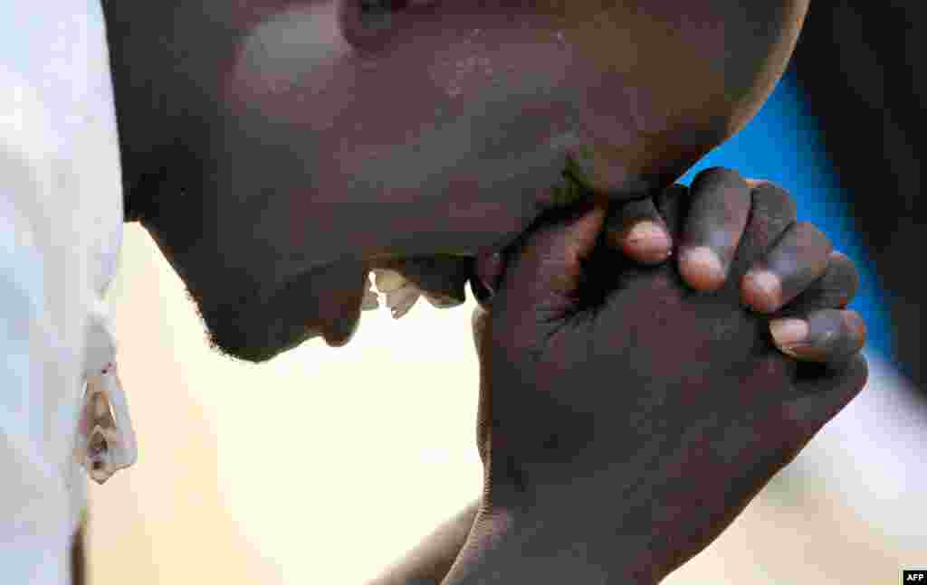 A man prays at the John Garang Mausoleum before the Independence Day celebrations July 9, 2011 in Juba, South Sudan. (Reuters)