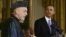 President Barack Obama listens as Afghan President Hamid Karzai speaks during a news conference in the East Room at the White House in Washington, January 11, 2013.