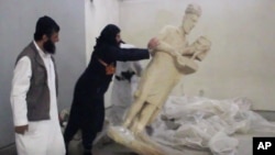 A video from the Islamic State group purports to show militants destroying ancient artifacts in Iraq’s Mosul Museum. It was released Feb. 26, 2015.