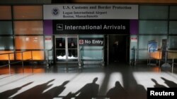 An international traveler arrives after U.S. President Donald Trump's executive order travel ban at Logan Airport in Boston, Massachusetts, Jan. 30, 2017.