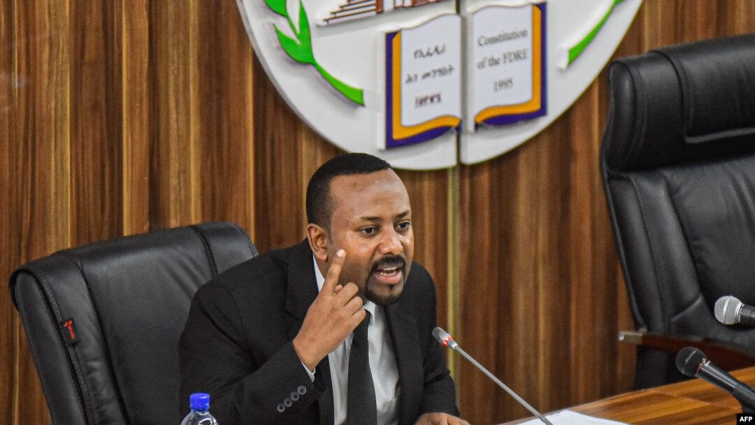 FILE - Ethiopia's Prime Minister Abiy Ahmed addresses the parliament in Addis Ababa, July 1, 2019. Ahmed's government has dropped charges against Israeli businessman Menashe Levy, who had been in prison since 2015. Levy has since been released.