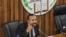 FILE - Ethiopia's Prime Minister Abiy Ahmed addresses the parliament in Addis Ababa, July 1, 2019. Ahmed's government has dropped charges against Israeli businessman Menashe Levy, who had been in prison since 2015. Levy has since been released.