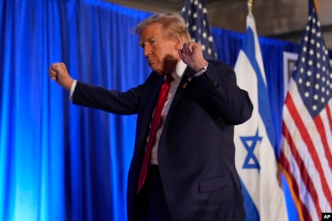 Republican presidential nominee former President Donald Trump leaves an event marking one year since the Oct. 7 Hamas attack on Israel, Oct. 7, 2024, in Miami.