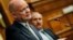 British Foreign Secretary William Hague speaks as Jordanian Foreign Minister Nasser Judeh (R) listens during their joint news conference before a meeting of the Friends of Syria alliance in Amman, May 22, 2013. 