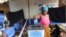 FILE - A woman votes in Liberia's Special Senatorial election.