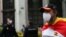 A man wearing a protective face mask, a Spanish flag and a t-shirt that reads: 'Go away Sanchez' attends a protest against the Spanish government's handling of the coronavirus crisis in Madrid, Spain May 16, 2020.